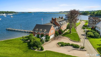 Tucked away on a quiet cul-de-sac on the western shore of the - photo 2