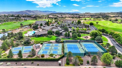 Located on the 9th hole of The Club at Prescott Lakes, this