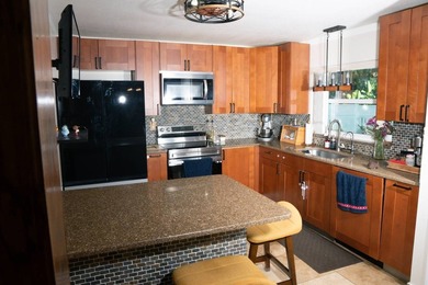 This charming three-bedroom, two-bathroom house offers a unique - photo 8