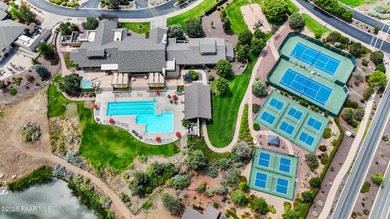 Located on the 9th hole of The Club at Prescott Lakes, this