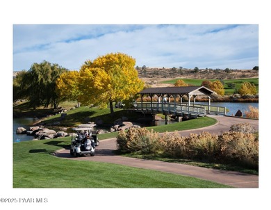 Located on the 9th hole of The Club at Prescott Lakes, this
