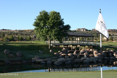 Located on the 9th hole of The Club at Prescott Lakes, this