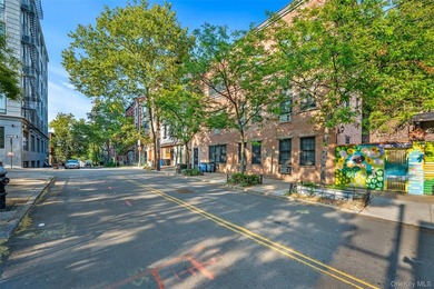 Discover this exceptional three-family property in one of - photo 1