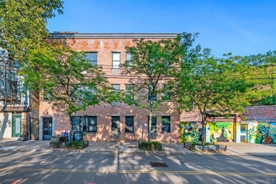 Discover this exceptional three-family property in one of - photo 2