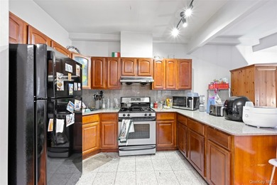 Discover this exceptional three-family property in one of - photo 6