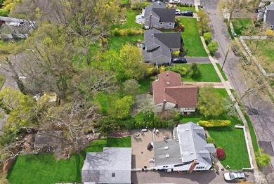 Spacious split-level home set on a huge, private wooded property - photo 39