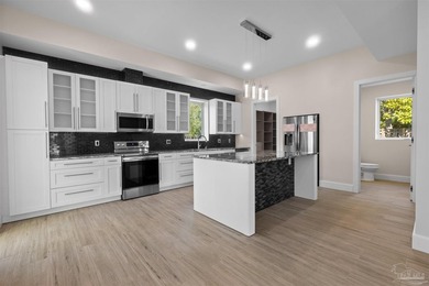 Experience modern Gulf Coast living at 5468 Cimmeron Ct in Gulf - photo 5