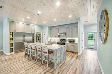 Discover this coastal luxury and pristine 2019-built, 7-bedroom - photo 18