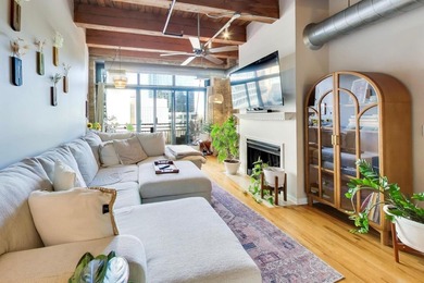 Step into this stunning brick-and-timber loft at the Premiere
