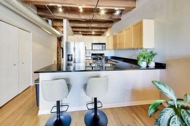 Step into this stunning brick-and-timber loft at the Premiere