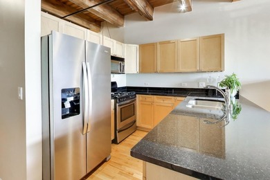 Step into this stunning brick-and-timber loft at the Premiere