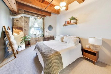 Step into this stunning brick-and-timber loft at the Premiere