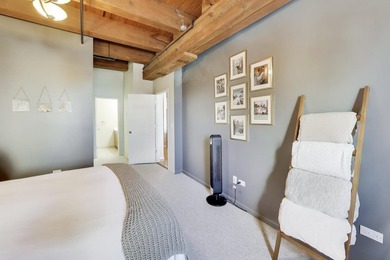 Step into this stunning brick-and-timber loft at the Premiere