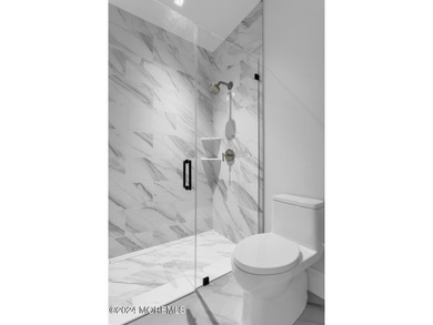 Experience unobstructed panoramic water views of the Manhattan - photo 12