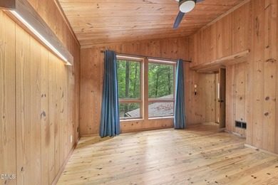 Nestled among mature hardwoods on a private, wooded homesite - photo 12