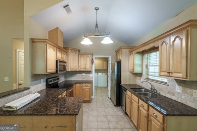 Set along the coveted shoreline of Lake Oconee, this exceptional - photo 17