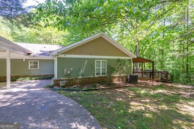 Set along the coveted shoreline of Lake Oconee, this exceptional - photo 41