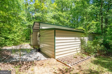 Set along the coveted shoreline of Lake Oconee, this exceptional - photo 46