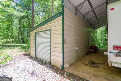 Set along the coveted shoreline of Lake Oconee, this exceptional - photo 47