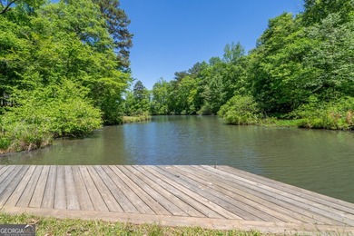 Set along the coveted shoreline of Lake Oconee, this exceptional - photo 49
