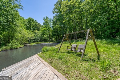 Set along the coveted shoreline of Lake Oconee, this exceptional - photo 50