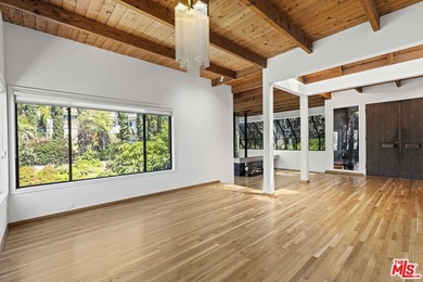 Built in 1980, this architectural gem showcases many of the - photo 11