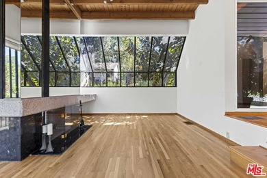 Built in 1980, this architectural gem showcases many of the - photo 13