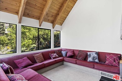 Built in 1980, this architectural gem showcases many of the - photo 14