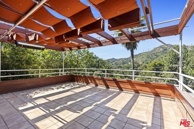 Built in 1980, this architectural gem showcases many of the - photo 21