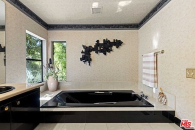 Built in 1980, this architectural gem showcases many of the - photo 23