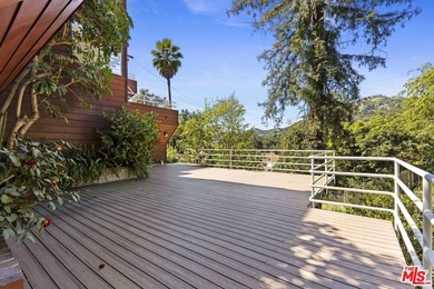 Built in 1980, this architectural gem showcases many of the - photo 28
