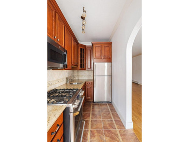 213 East 120th Street presents a compelling four-unit, mixed-use - photo 8