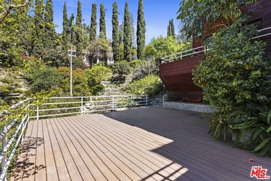 Built in 1980, this architectural gem showcases many of the - photo 29