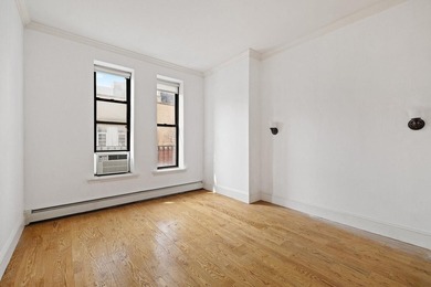 213 East 120th Street presents a compelling four-unit, mixed-use - photo 9
