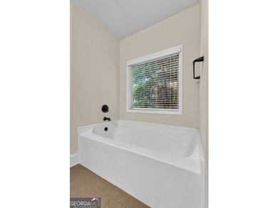 This charming 3-bedroom, 2-bath home is nestled in the sought - photo 22