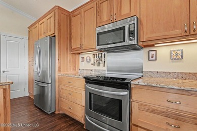 Tucked inside the highly sought-after Pass Christian Isles, this - photo 11