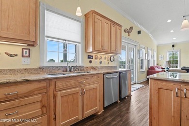 Tucked inside the highly sought-after Pass Christian Isles, this - photo 12