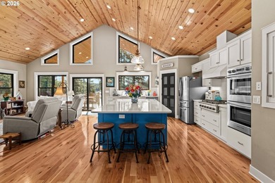 Set on 1.24 private waterfront acres, this exceptional - photo 2