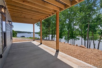 Stunning new-construction waterfront home at the Lake of the - photo 12