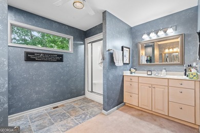 Set along the shores of Lake Lanier, this thoughtfully designed - photo 18