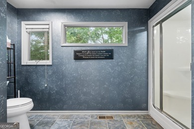Set along the shores of Lake Lanier, this thoughtfully designed - photo 20