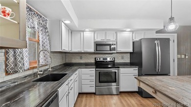 Lake life is calling! Wake up to beautiful lake views in this - photo 18