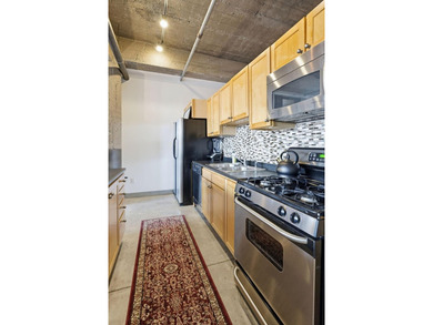 Discover authentic North Loop loft living in this bright - photo 7