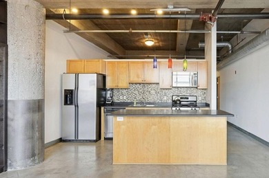 Discover authentic North Loop loft living in this bright - photo 9