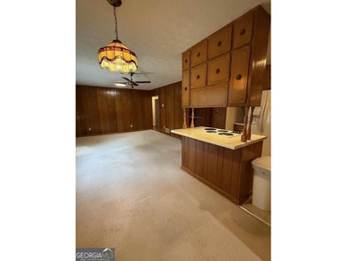 Nestled at 1840 Flat Shoals Road SE, Conyers, GA, this inviting