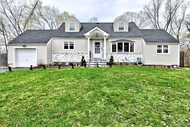 UPDATED SPACIOUS CAPE , 4 BEDROOMS 2 BATHROOMS, EAT IN KITCHEN - photo 2
