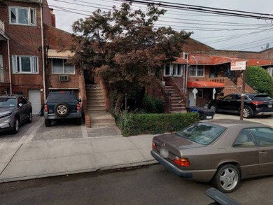 Welcome to this move-in ready brick two-family home nestled in - photo 1