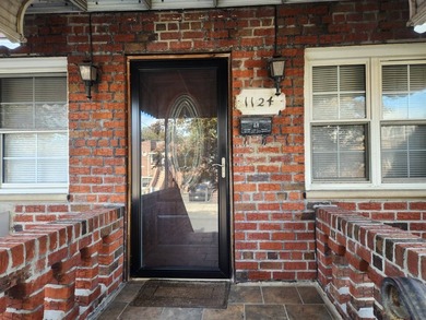 Welcome to this move-in ready brick two-family home nestled in - photo 3