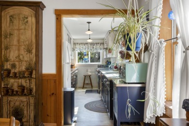 Welcome to this beautifully updated New England-style home with