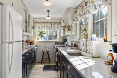 Welcome to this beautifully updated New England-style home with